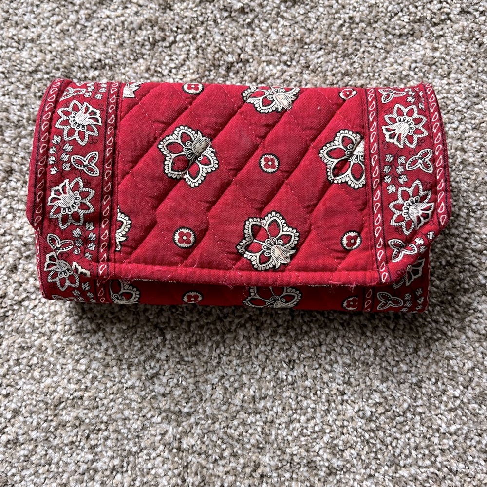 Vera Bradley clutch with Velcro closure. Multiple pockets, dark red and cream.